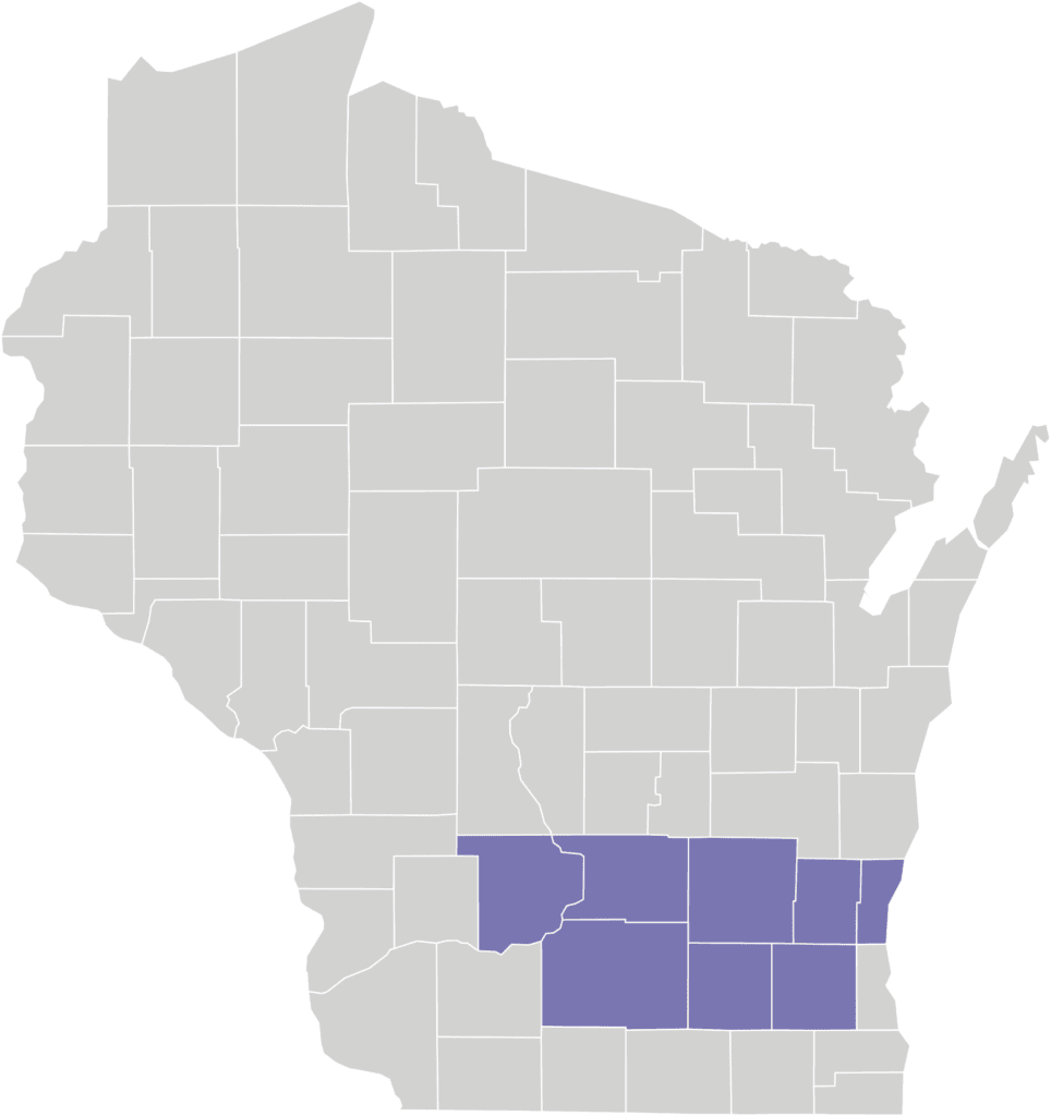 A gray map of Wisconsin with 8 purple counties colored in to show Partnership program coverage